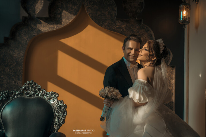 Cinematic Kuwait wedding photographers filming a majestic bridal entrance at a grand ballroom.