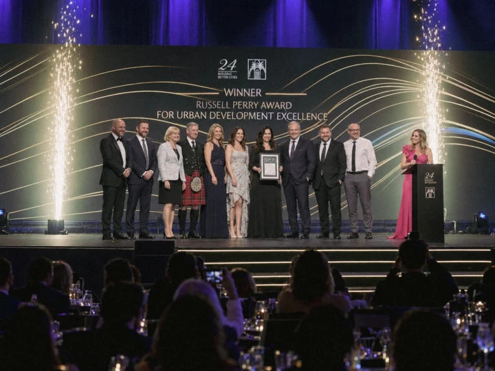 Corporate award ceremony group on stage with pyrotechnics during a formal event, photographed for professional event coverage in Dubai and Abu Dhabi.